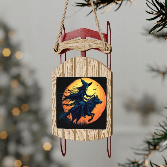 Halloween Witch Riding a Wolf Under Full Moon Sled Ornaments
