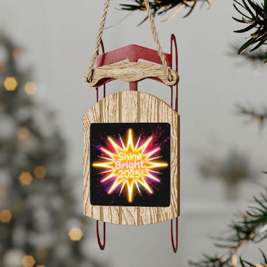 A large starburst glowing in neon light with 2025 Sled Ornaments