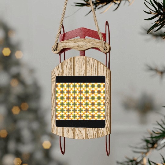 A colorful mixture of yellow green brown orange Sled Ornaments