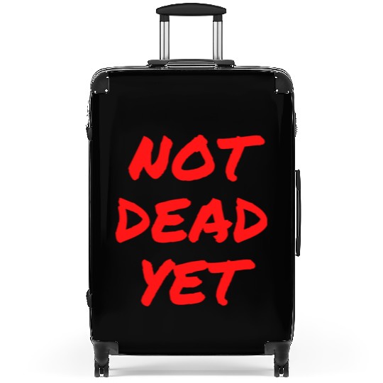 NOT DEAD YET (in graffiti red letters) Suitcases