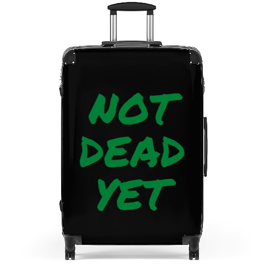 NOT DEAD YET (in green graffiti letters) Suitcases