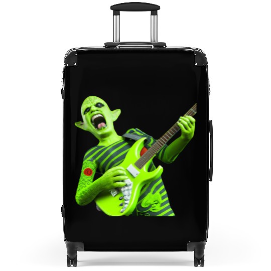 Huge green alien jamming on an electric guitar. Suitcases
