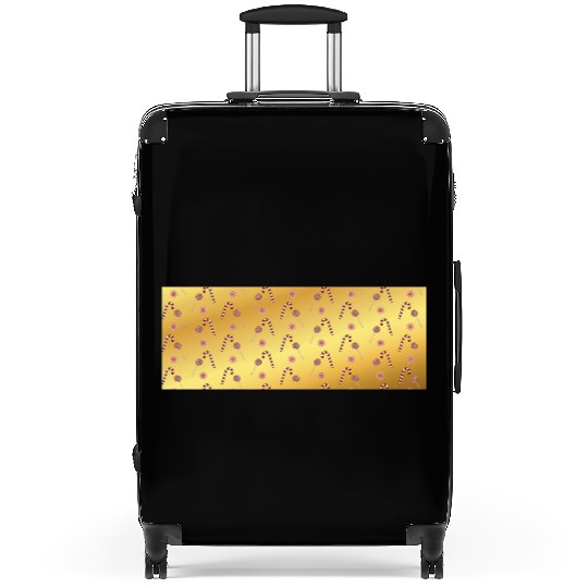 Christmas candy canes on a golden imitation backgr Suitcases