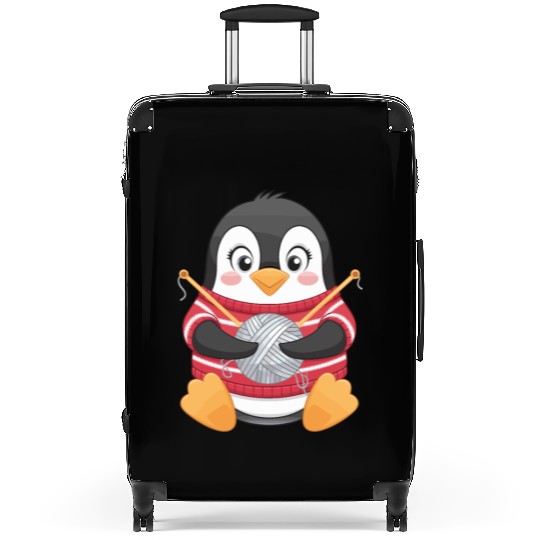 Knitting Penguin with Yarn in Sweater Suitcases
