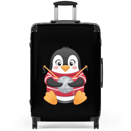 Knitting Penguin with Yarn in Sweater Suitcases