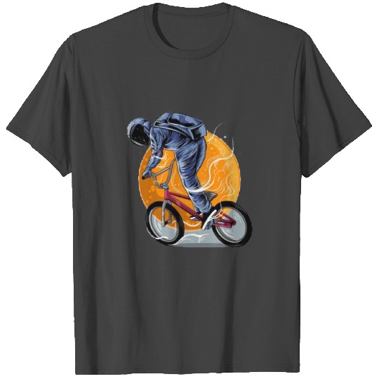An astronaut rides a BMX bike in space. T Shirts