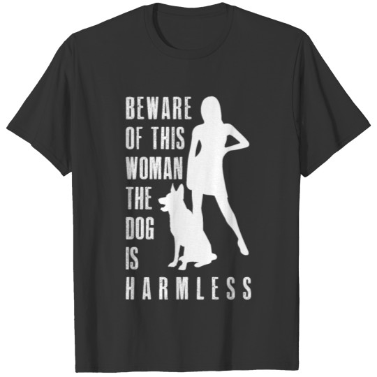 BEWARE OF THIS WOMAN THE DOG IS HARMLESS T-shirt