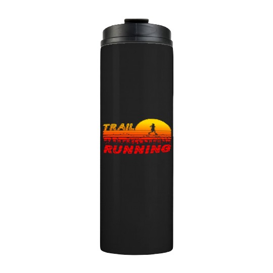 Trail running in orange sunset with mountains Thermal Tumblers