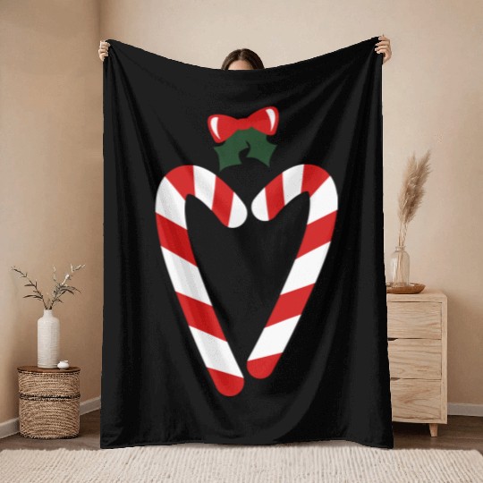 beautiful christmas candy canes in love heart with Throw Blankets