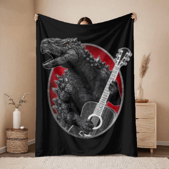 Kaiju playing guitar Throw Blankets