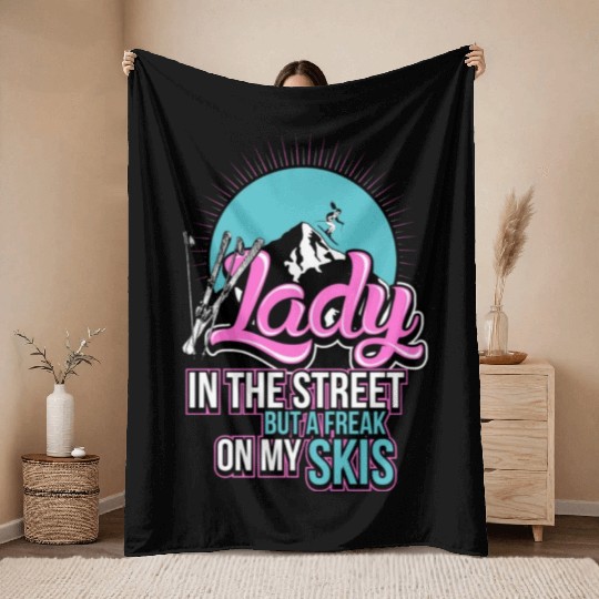 Skiing Lady in the street but a freak on my skis Throw Blankets