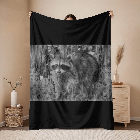 cute racoon walking through wooded forest Throw Blankets