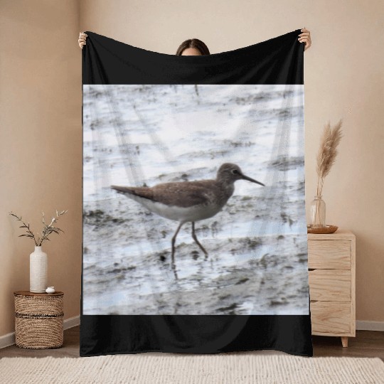 Sandpiper walking along the shore Throw Blankets