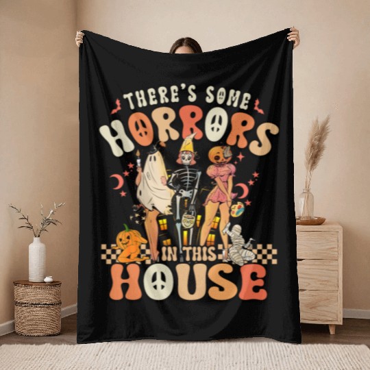 Halloween There's some horrors in this house Throw Blankets