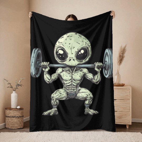 Alien at the Gym Throw Blankets
