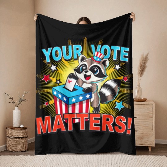 A raccoon casts its vote in the US election Throw Blankets