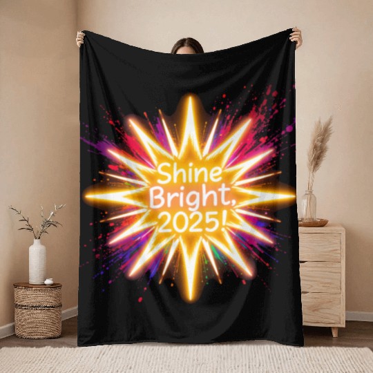 A large starburst glowing in neon light with 2025 Throw Blankets