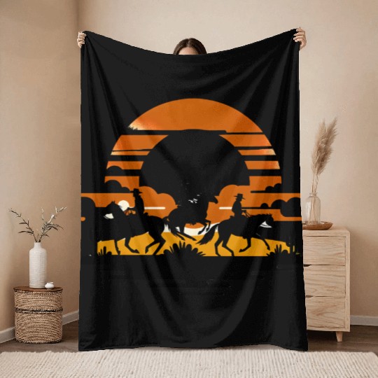 Western Riders at Sunset Throw Blankets