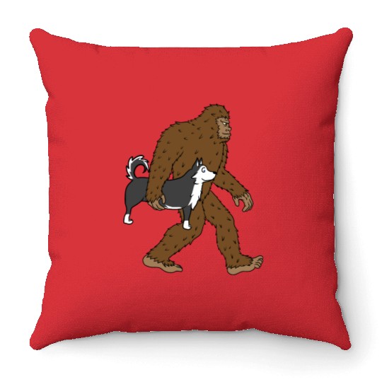 Bigfoot Sasquatch Carrying Husky Throw Pillows