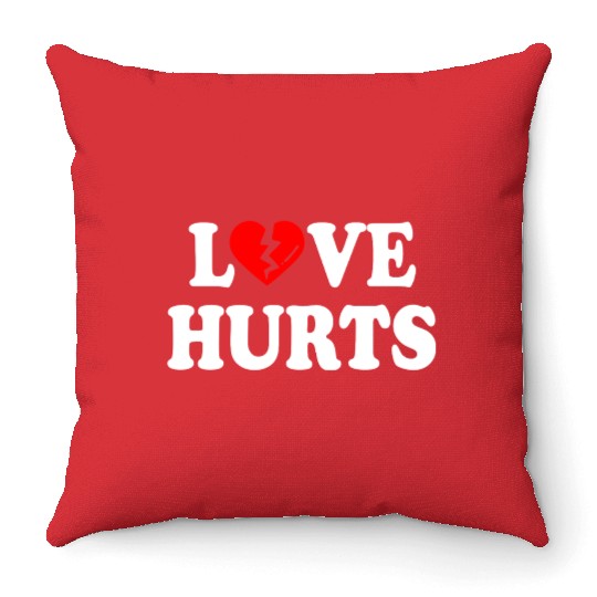love hurts Throw Pillows
