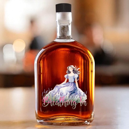 Girl in Lavender Dress Relaxing in Flower Field Whiskey Bottles