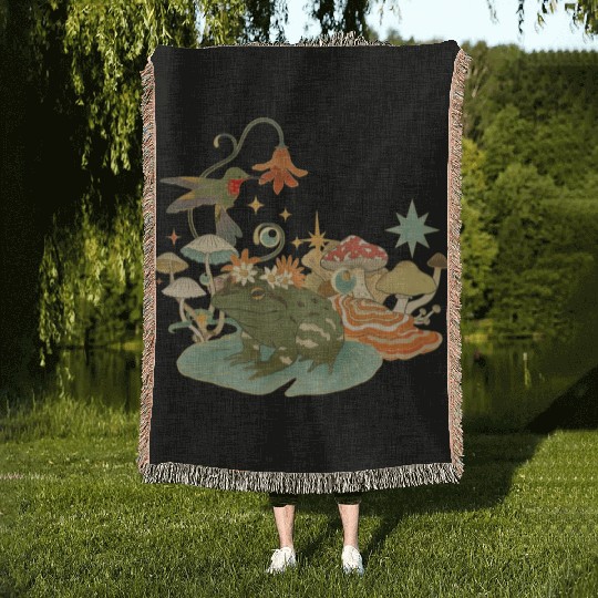 Cottagecore with frog, mushrooms and hummingbird Woven Blankets