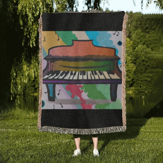 A beautiful piano in front of a colorful rainbow Woven Blankets