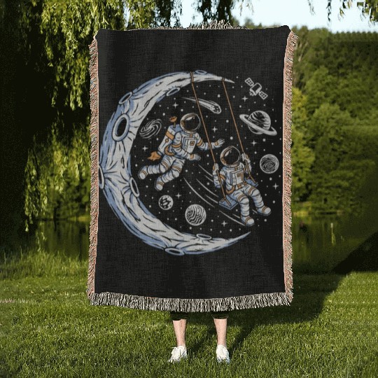 Astronauts on swing on moon Woven Blankets