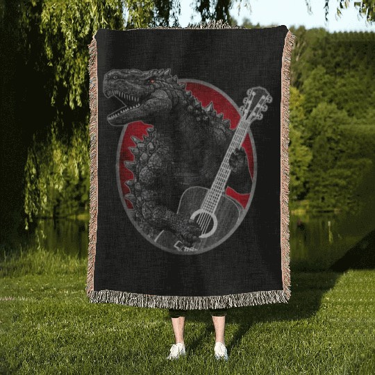 Kaiju playing guitar Woven Blankets
