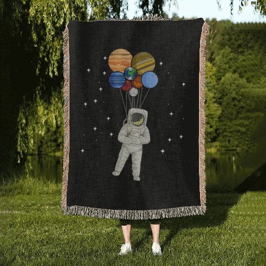 Astronaut Holding Planet Balloons of Solar System Woven Blankets