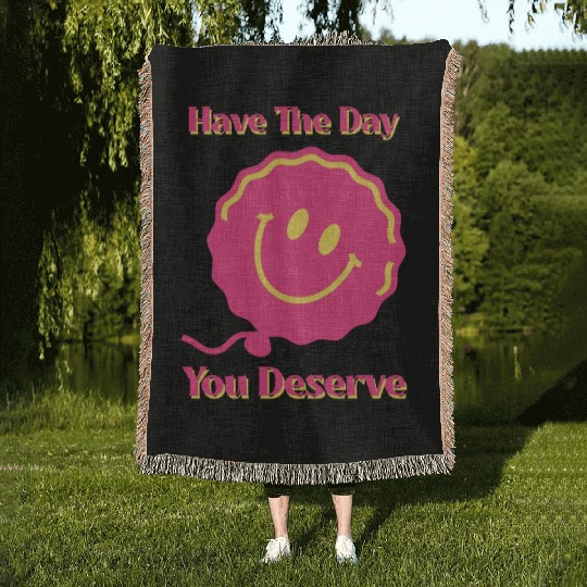Have The Day You Deserve, pink smile face, balloon Woven Blankets