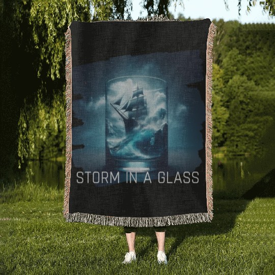 A storm in a glass with a ship Woven Blankets