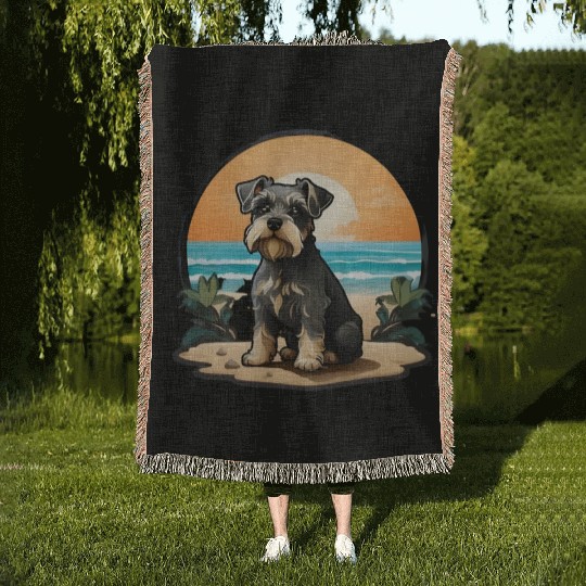 A miniature schnauzer dog in the beach Woven Blankets