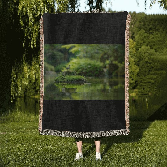Serene Pond with Bird on Mossy Rock Woven Blankets