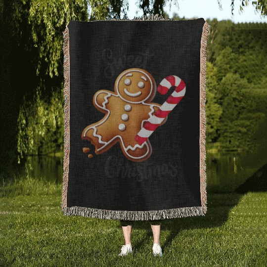 Happy gingerbread man with candy cane Woven Blankets