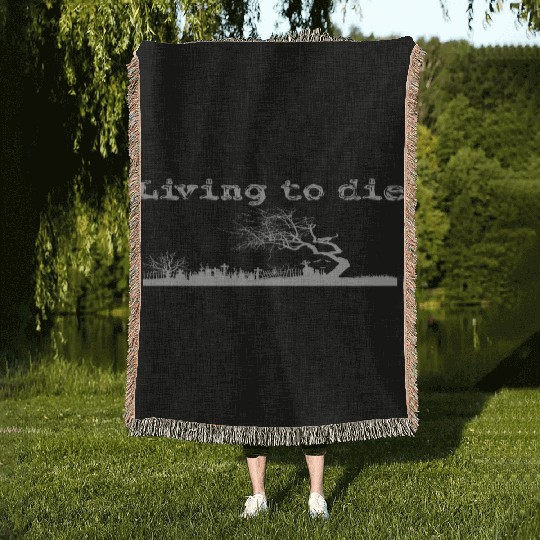 Graveyard shilouet typography Living to die Woven Blankets