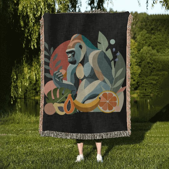 Proud gorilla with banana in tropical surroundings Woven Blankets