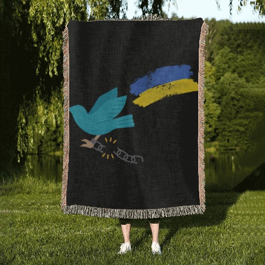 Dove of peace carrying the flag of Ukraine Woven Blankets