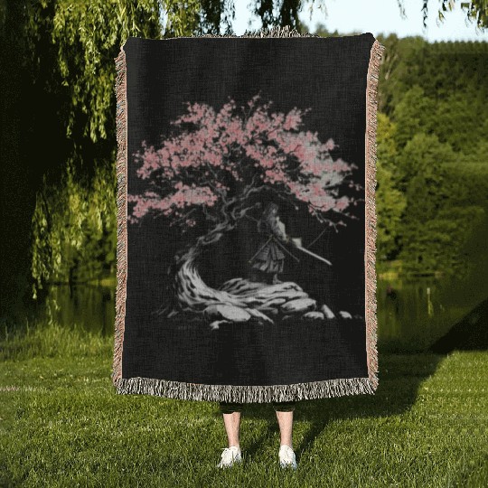 Samurai trains beneath a blooming Sakura tree Woven Blankets