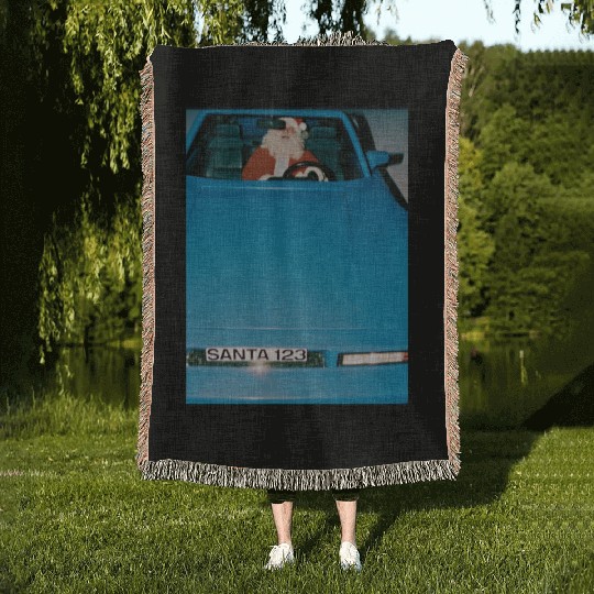 Santa Driving a Classic Blue Sports Car Woven Blankets